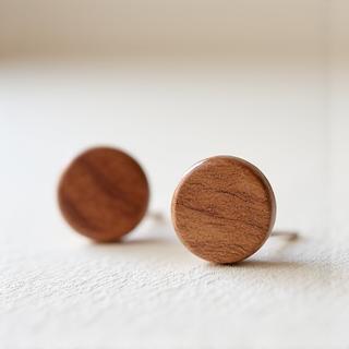 Handmade wooden stud earrings showing lightweight design